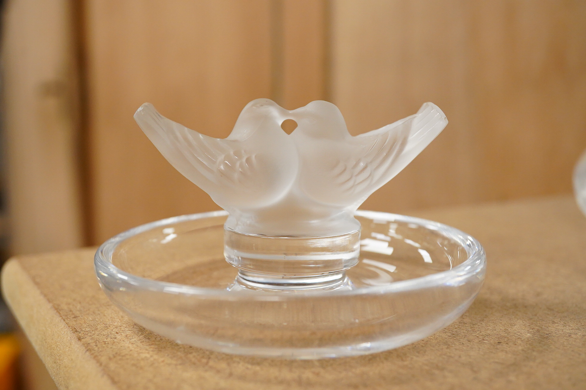 A Lalique scent bottle with stopper, a Lalique lovebirds pin-dish and and a Lalique heart-shape knot, scent bottle 12cm